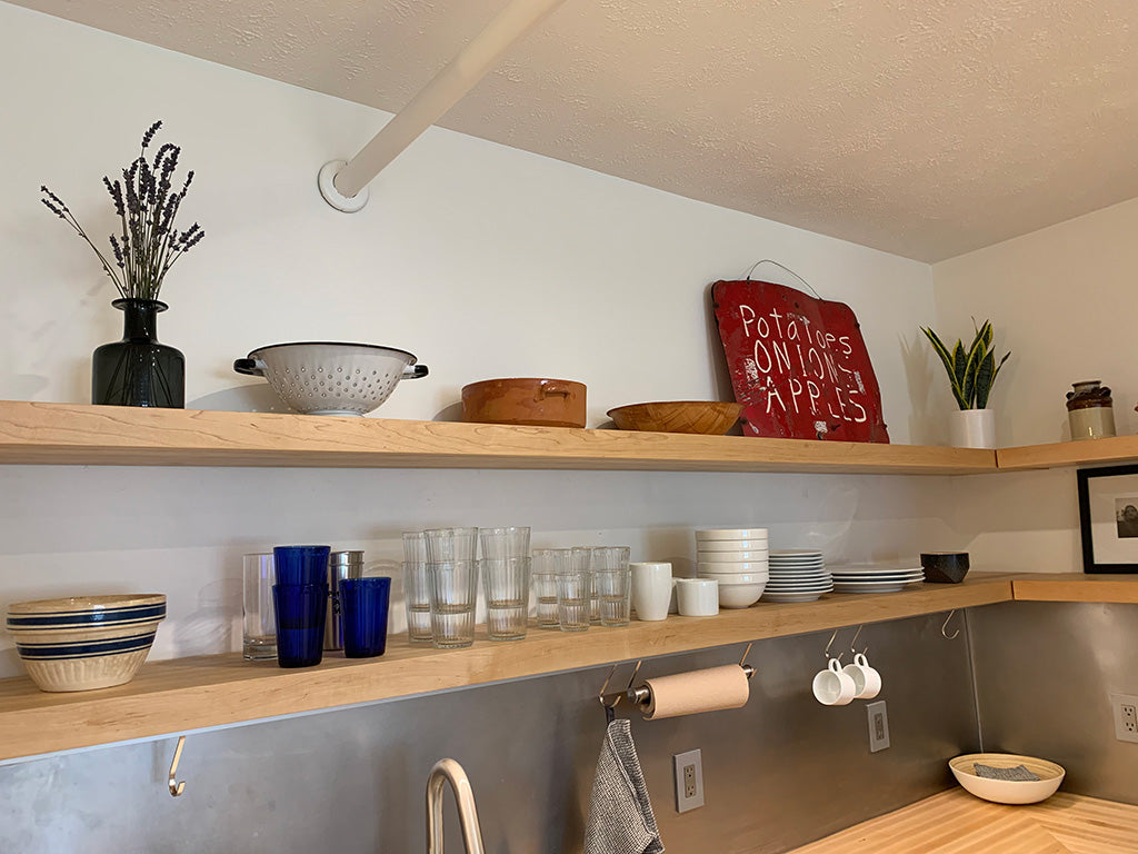 Maple floating shelves installed above a maple butcherblock countertop.